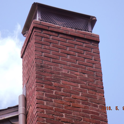 Chimney sweeps install new chimney cap in Collinsville CT