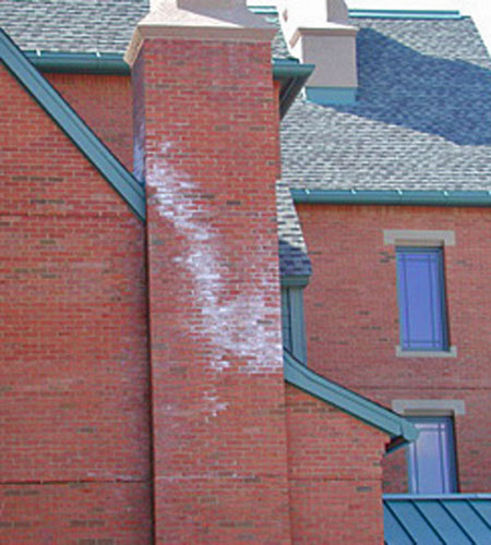 rusty read stains on chimney in need of inspection