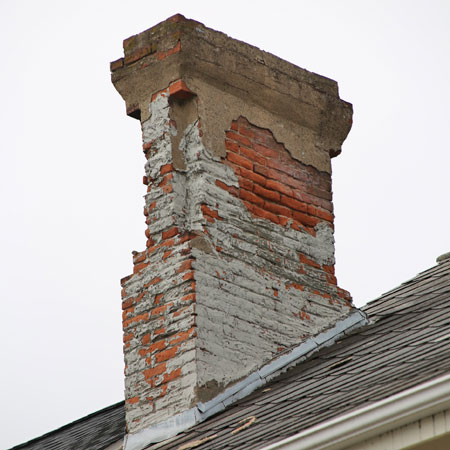white stained chimney in need of repair in burlington ct
